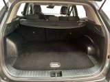 a trunk of a car with the back seats folded down