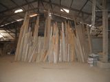 a large pile of wood in the middle of a building
