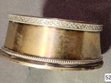 a gold ring that is sitting on top of a table