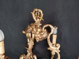a gold candle holder with a horse on top of it