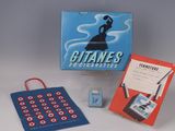 a box of cigarettes and a card game on the table