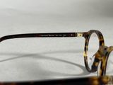 a pair of glasses sitting on a white surface