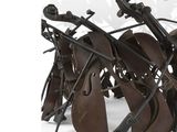 a metal sculpture of a musical instrument on display