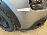a close up of a car ' s bumper with a sticker on it