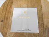 a wooden plate with a menu on it on a table