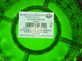 green glass bowl with barcode label on top of it