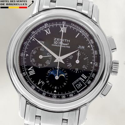 a close up of a watch with roman numerals on the face