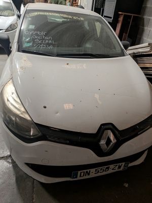 a picture of a white car parked in a garage
