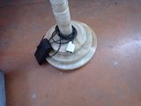 a white umbrella that is sitting on the floor