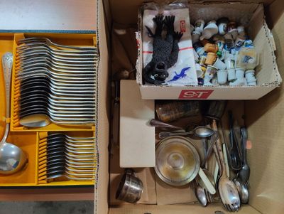 a box full of silverware and spoons in it