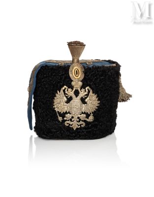 an image of a black purse with a gold eagle on it