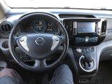 dashboard of a car with a person sitting in the driver ' s seat