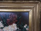 a picture of a painting of flowers in a gold frame