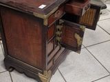 a wooden desk with a drawer on top of it
