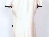 an image of a mannequin wearing a white dress with black trims