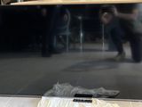 a tv that is sitting on the floor in the room