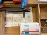 a stapler and a stapler in a box on the floor