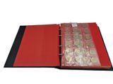 a close up of a red binder with coins in it