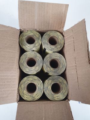 six rolls of thread in a box on a white surface