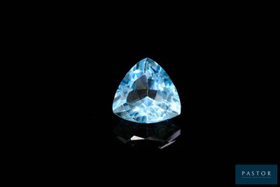 a blue topazte gems on a black background