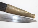 two knives that are sitting next to each other on a table