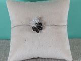 a close up of a pillow with a bee on it