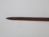 a close up of a knife on a white surface