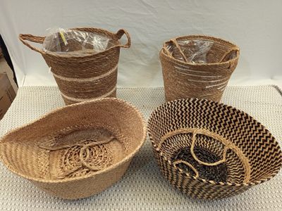 three woven baskets are sitting on top of a table