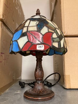 a lamp that is sitting on a table next to a box