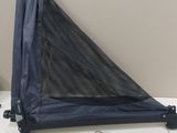 a black net hanging from the side of a bed