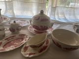 a table with a lot of dishes and cups on it