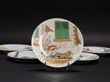 three plates with a picture of a man and a dog on them