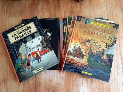three children ' s books sitting on a wooden table next to each other