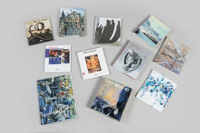 a lot of books that are on the table
