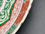 a close up of a colorful plate on a table
