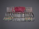 an image of a belt made out of silver and pink beads
