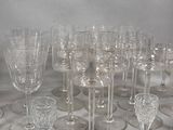 a lot of wine glasses that are sitting on a table