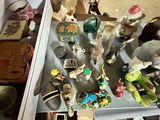 a lot of figurines that are on a table