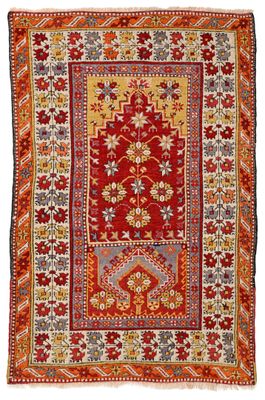 a red and yellow rug with a floral design