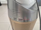 a silver and silver vacuum on a tiled floor