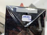 someone is holding a box of chocolates with a sticker on it