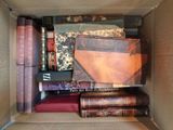 a cardboard box filled with many different books