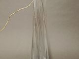 a glass bottle with a string attached to it