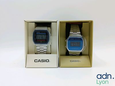 two casio watches in a box on a white surface