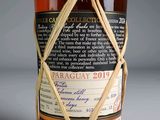 a bottle of wine wrapped up with a string