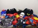 a table with a bunch of toys and masks on it