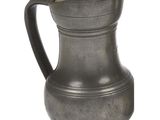 a small metal pitcher with a handle on a white background