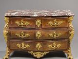 an antique chest of drawers with a marble top and gold accents