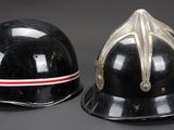 pair of black helmets with red and white stripes on them