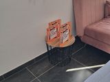a couch and a chair in a room with a window